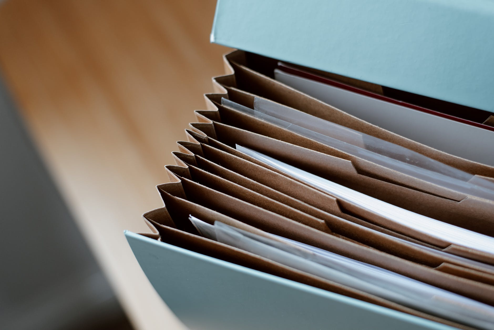 opened folder for documents on table